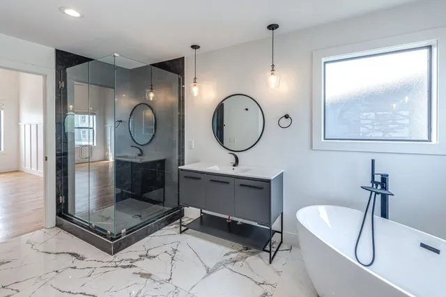 a living room with a mirror and a clock