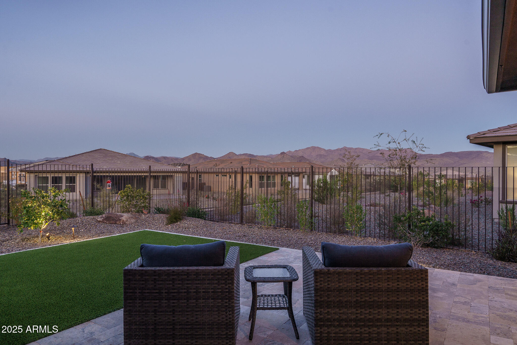 18166 East Juniper Oaks Drive Rio Verde, AZ 85263 - Photo 1 of 3 a view of a chairs and table in patio with a yard