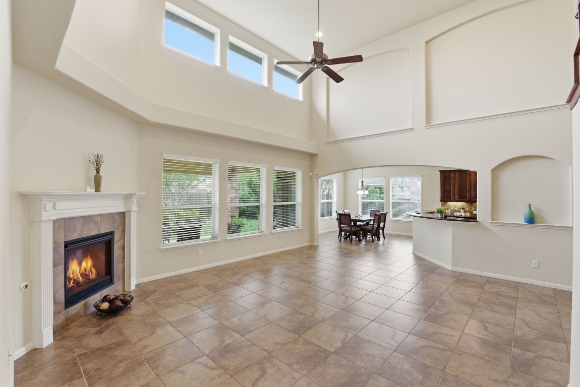 3301 Remington Rise Lane Katy, TX 77494 - Photo 14 of 50 a view of a livingroom with fireplace a flat screen tv and outdoor view