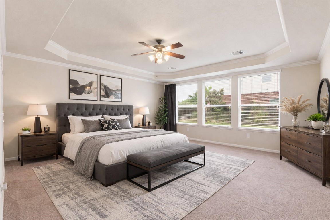 3301 Remington Rise Lane Katy, TX 77494 - Photo 21 of 50 a spacious bedroom with a large bed and a window