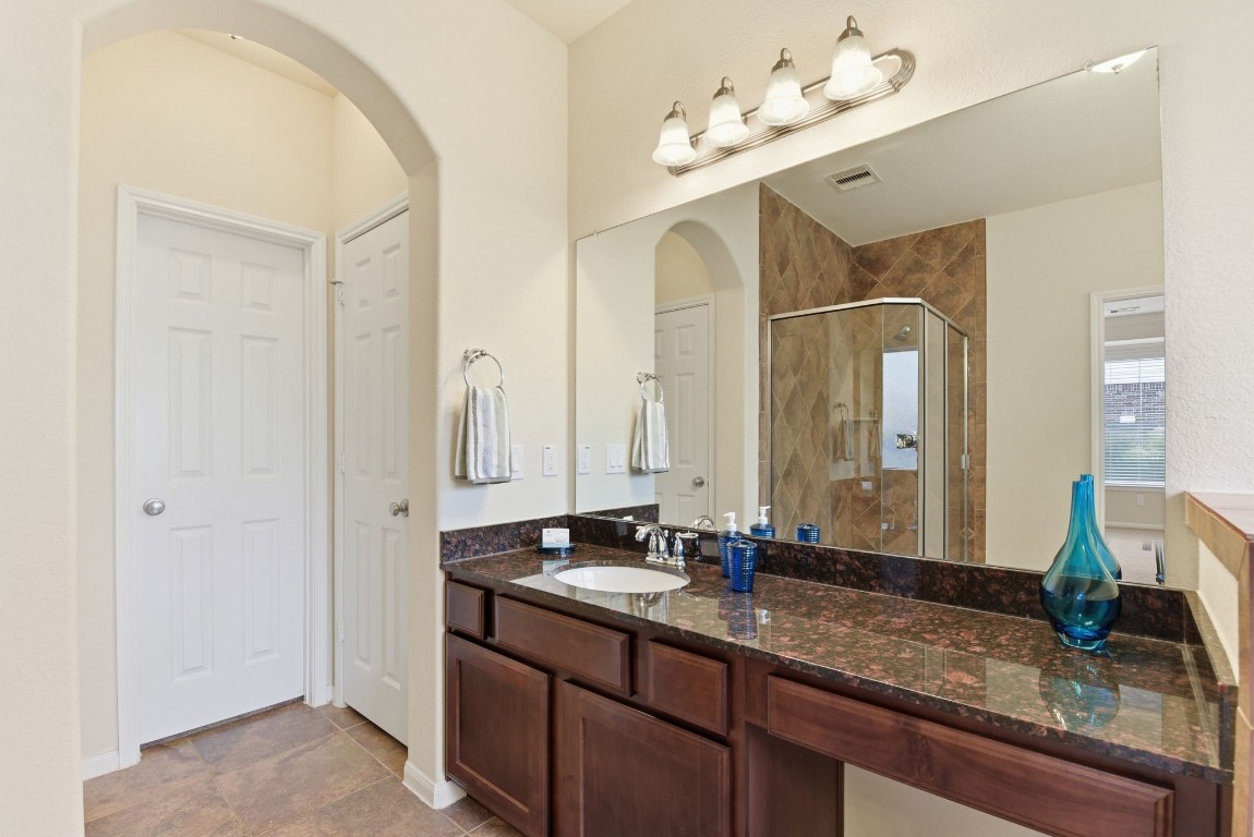 3301 Remington Rise Lane Katy, TX 77494 - Photo 25 of 50 a bathroom with a double vanity sink mirror and double