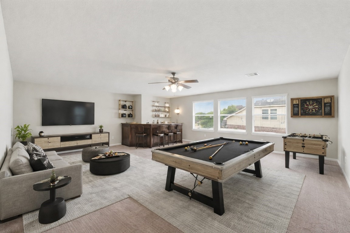 3301 Remington Rise Lane Katy, TX 77494 - Photo 30 of 50 a living room with furniture and a flat screen tv