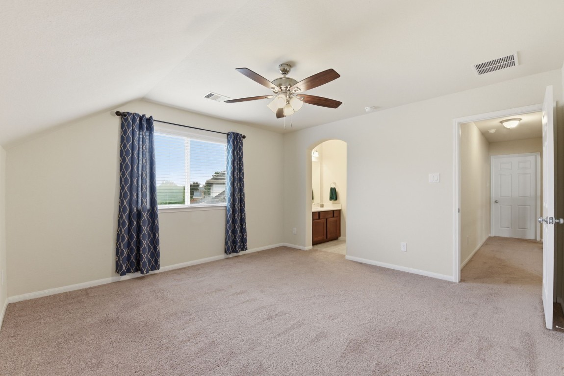 3301 Remington Rise Lane Katy, TX 77494 - Photo 39 of 50 a view of a livingroom with a ceiling fan and window