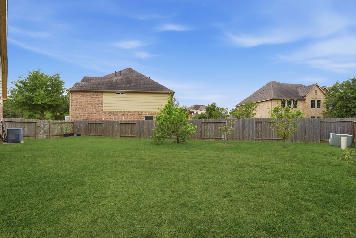 3301 Remington Rise Lane Katy, TX 77494 - Photo 42 of 50 a house view with a garden space
