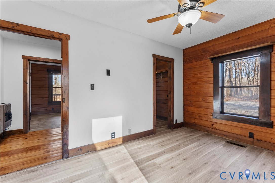 45 Morningside Road Cartersville, VA 23027 - Photo 26 of 50 a view of empty room with wooden floor and fan