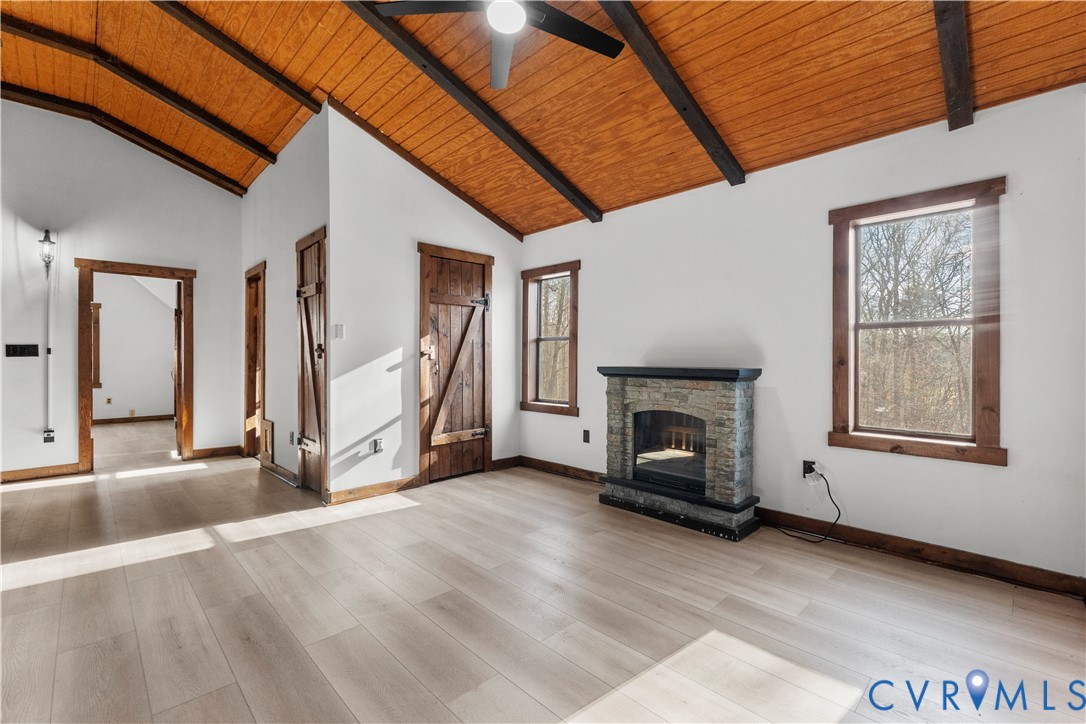 45 Morningside Road Cartersville, VA 23027 - Photo 33 of 50 a view of an empty room with wooden floor fireplace and a window