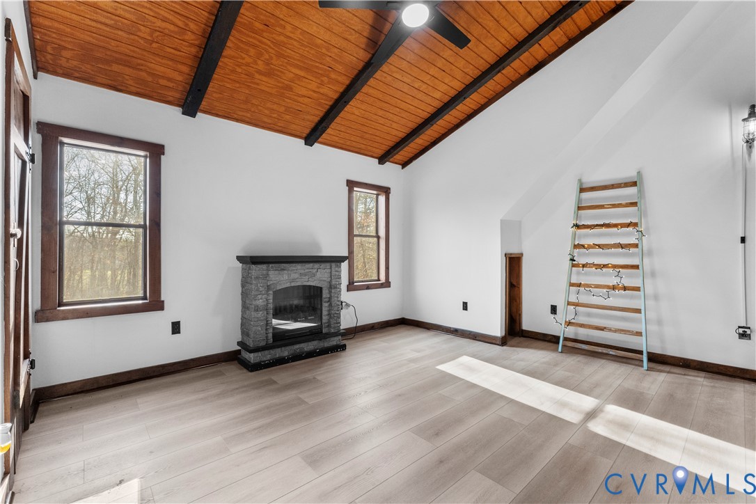 45 Morningside Road Cartersville, VA 23027 - Photo 34 of 50 an empty room with furniture a fireplace and wooden floor