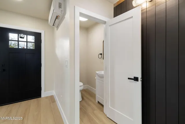 a view of a bathroom from a hallway