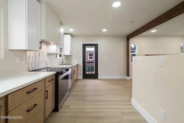 a kitchen with a sink and refrigerator