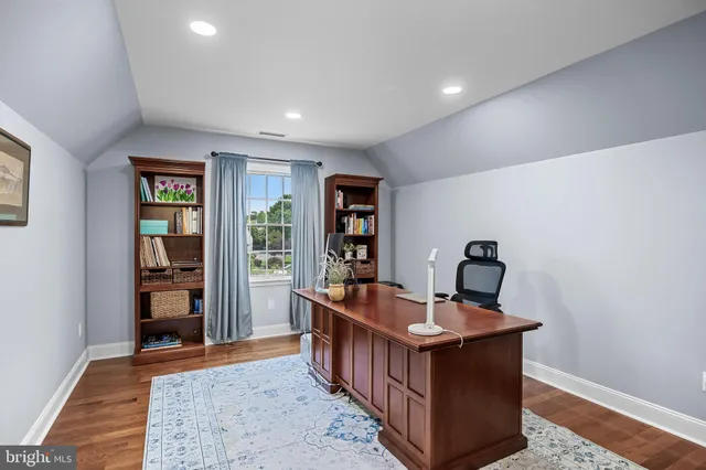 a room with furniture and wooden floor