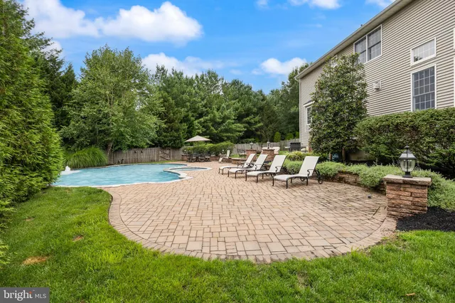 a view of a swimming pool with a patio