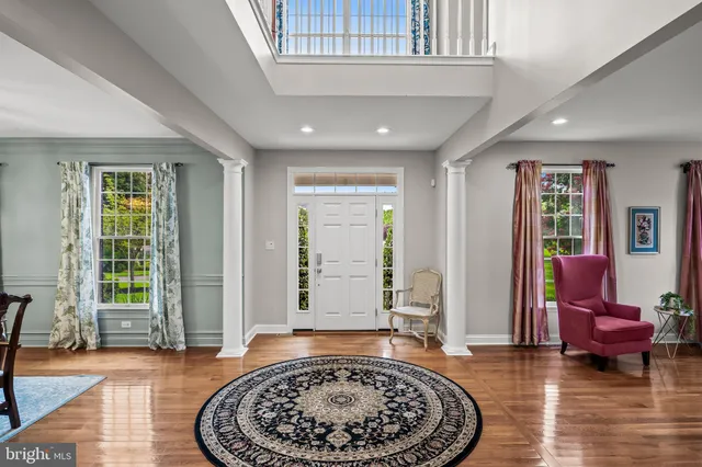 a view of a livingroom with furniture and staircase