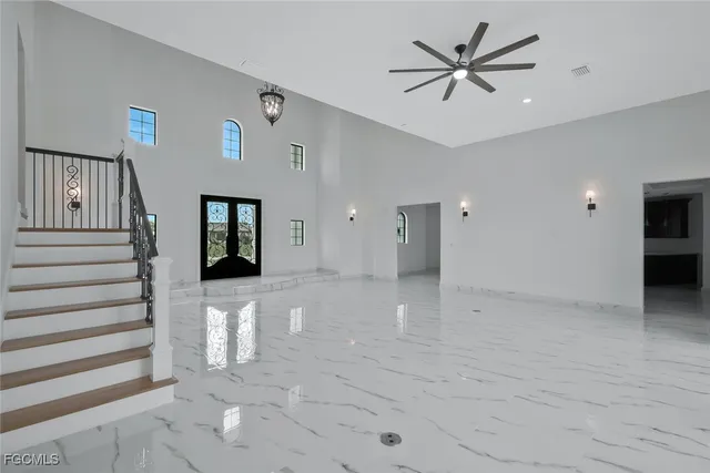 a kitchen with a counter space a sink stainless steel appliances and cabinets