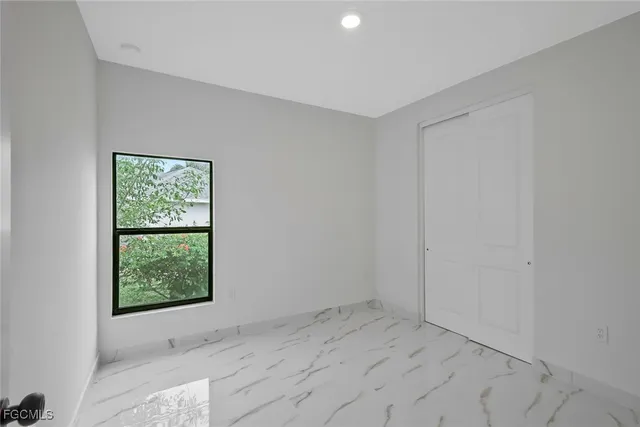 an empty room with windows