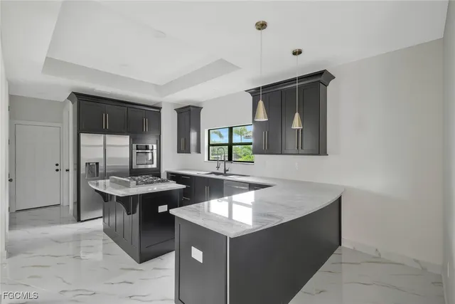 a kitchen with a sink and cabinets