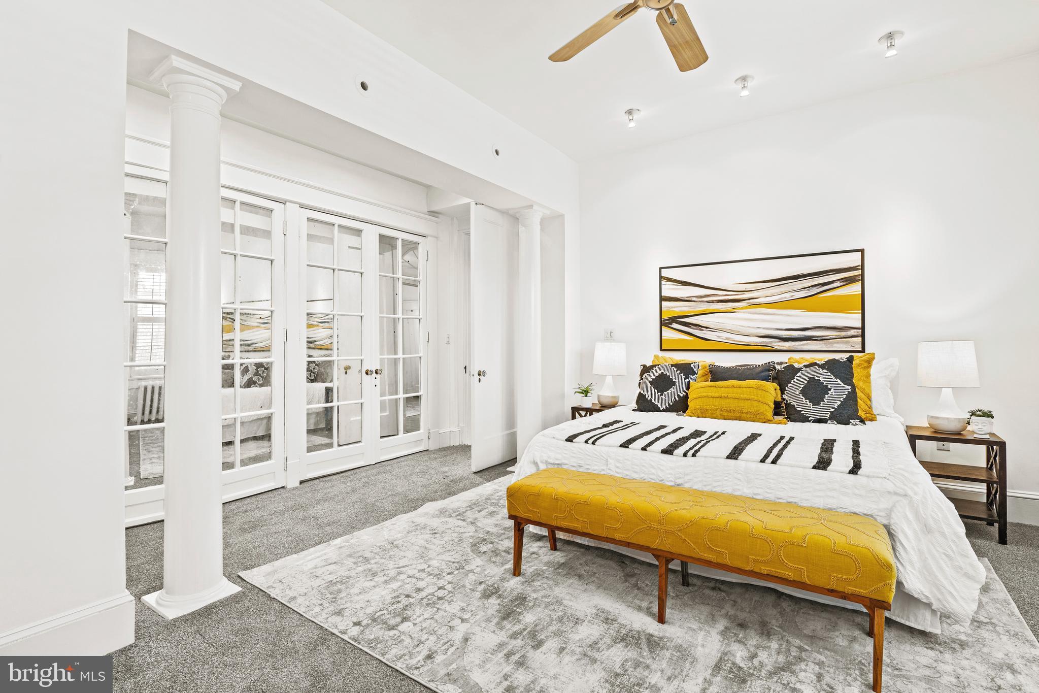 1736 Columbia Road Northwest, Unit 102 Washington, DC 20009 - Photo 15 of 37 a bedroom with a bed and wooden floor