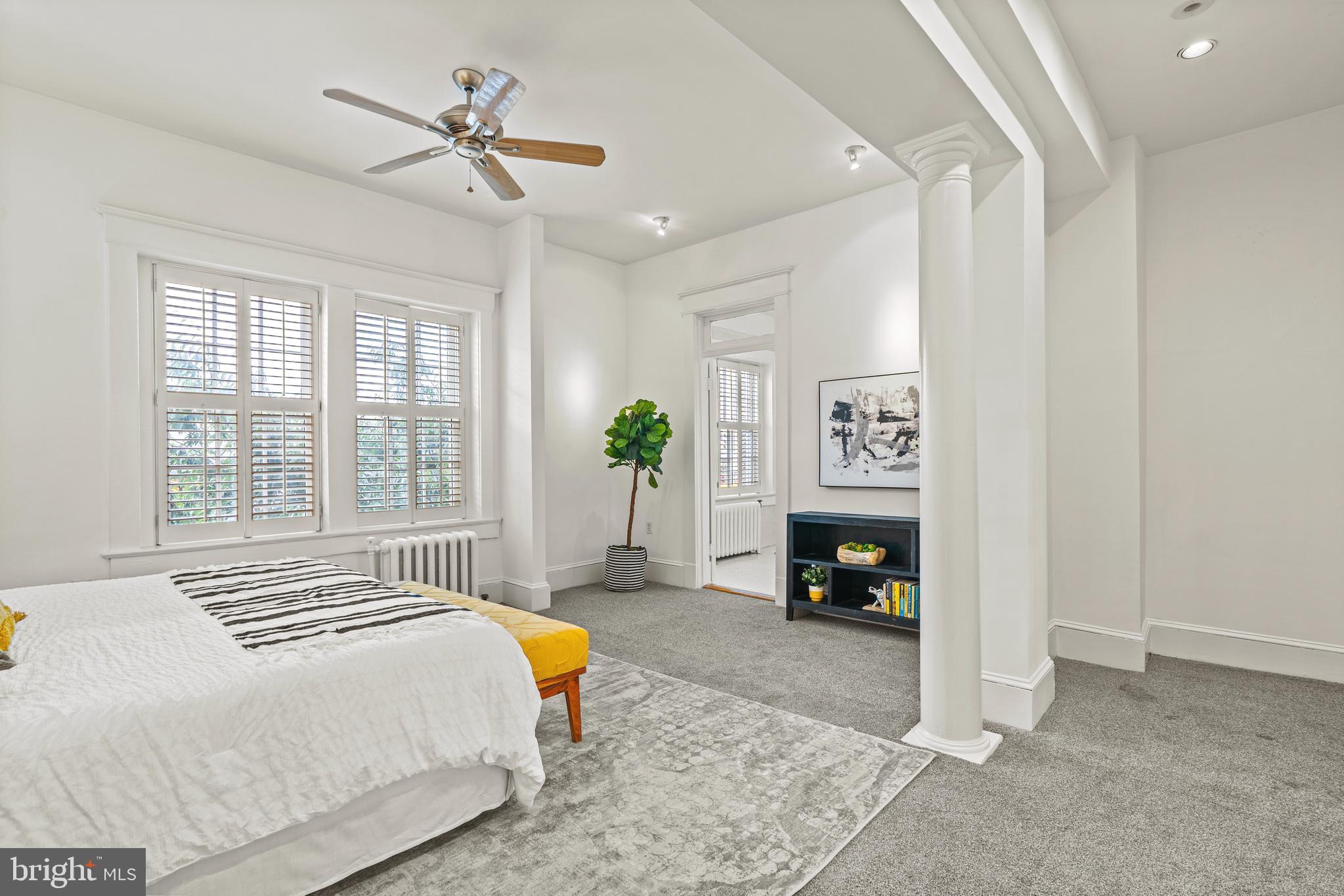1736 Columbia Road Northwest, Unit 102 Washington, DC 20009 - Photo 16 of 37 a bedroom with a bed dresser and a window