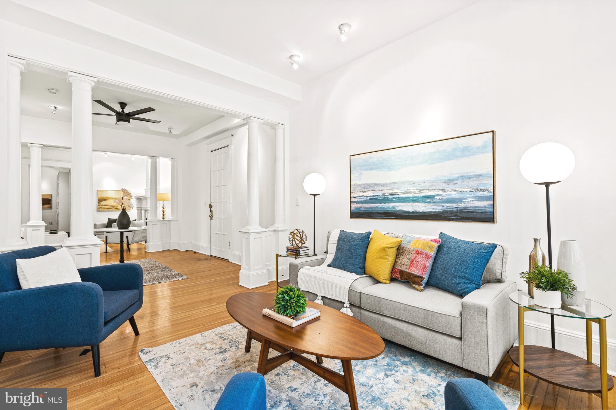 1736 Columbia Road Northwest, Unit 102 Washington, DC 20009 - Photo 6 of 37 a living room with furniture and wooden floor