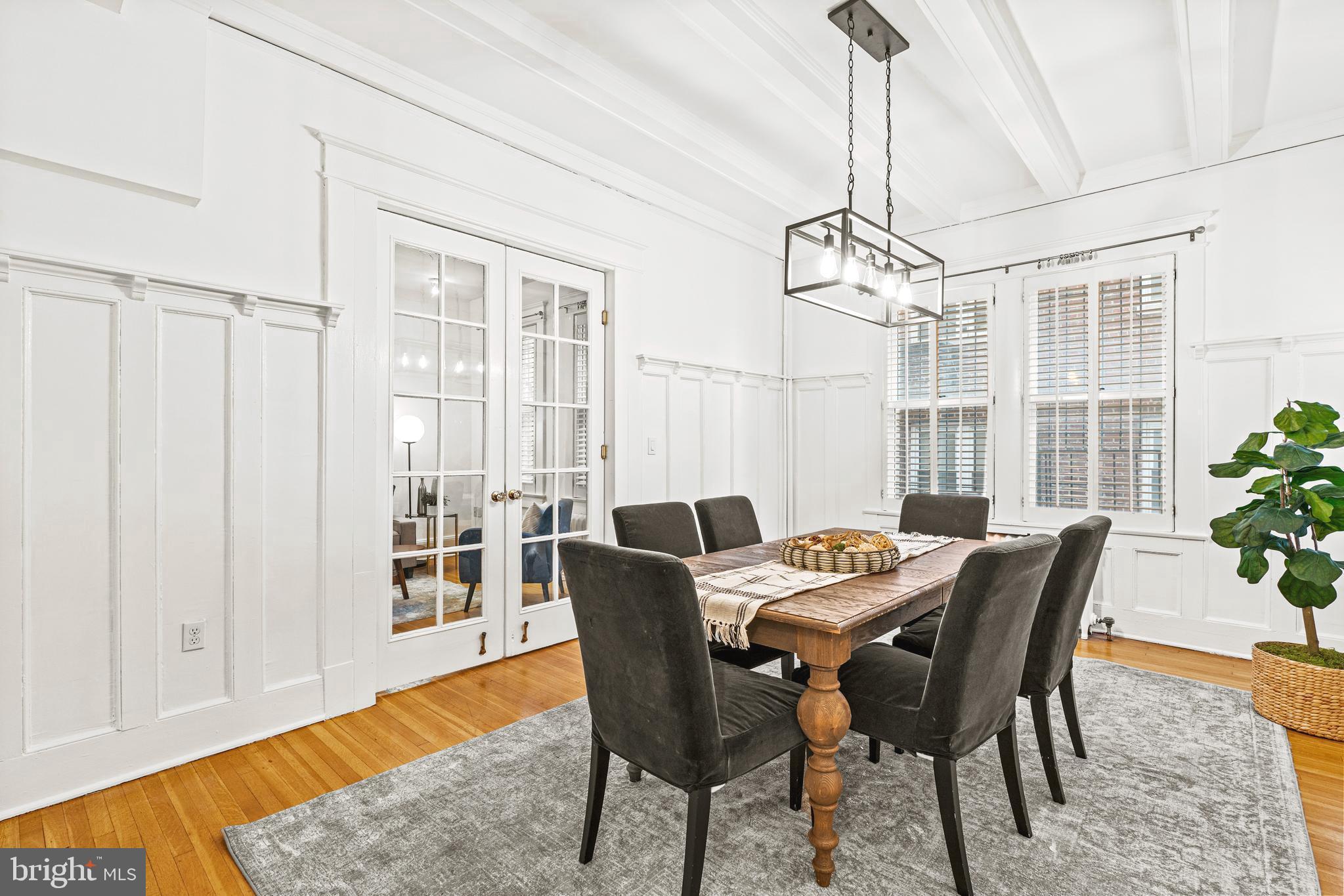 1736 Columbia Road Northwest, Unit 102 Washington, DC 20009 - Photo 9 of 37 a view of a dining room with furniture window and wooden floor