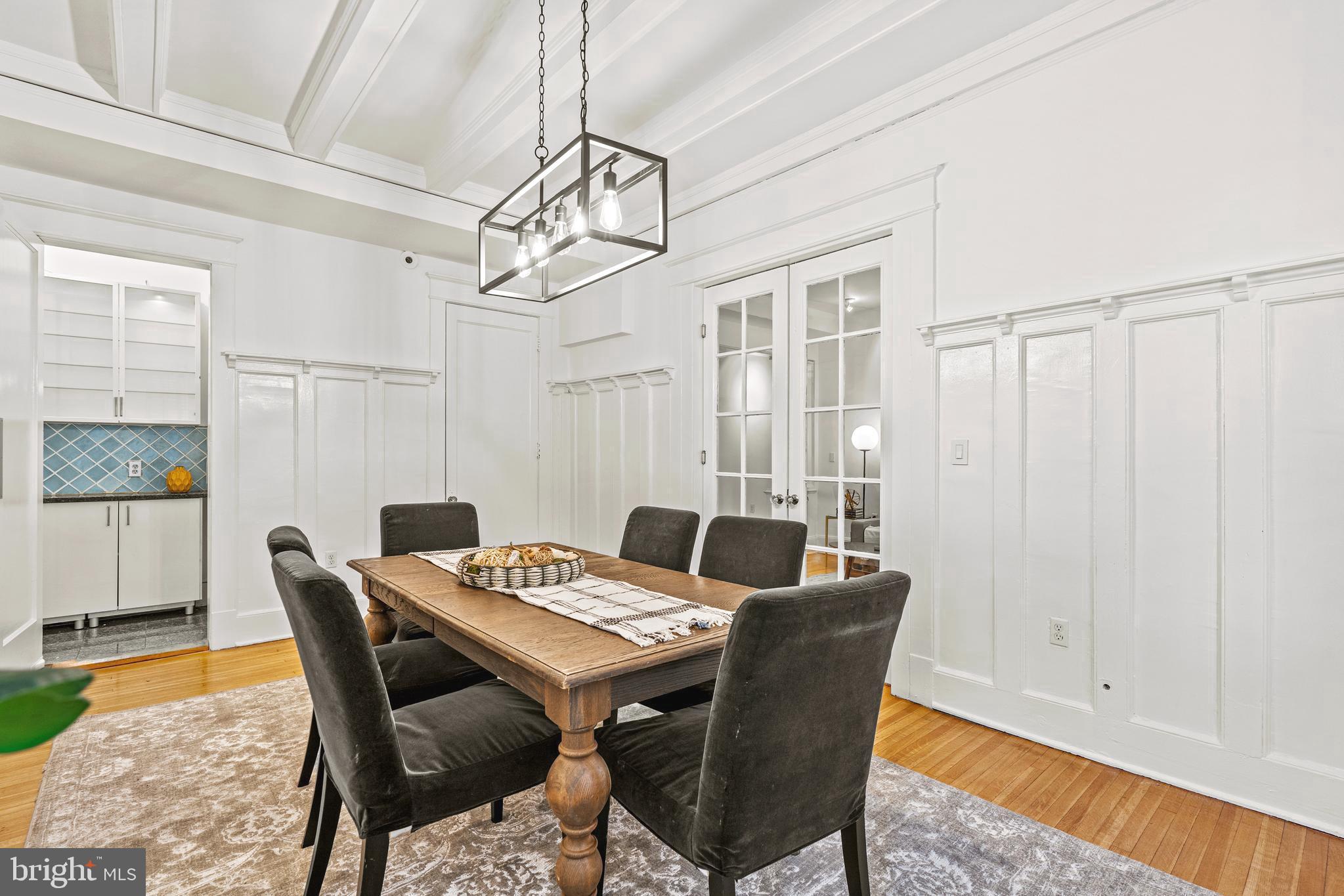 1736 Columbia Road Northwest, Unit 102 Washington, DC 20009 - Photo 10 of 37 a view of a dining room with furniture window and wooden floor