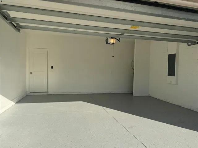 a view of a yard with large trees