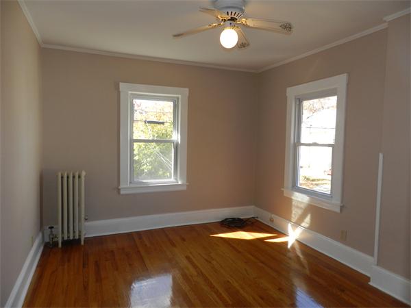 85 Appleton Street Springfield, MA 01108 - Photo 15 of 22 a view of empty room with wooden floor and fan