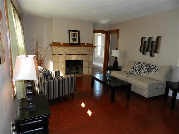 85 Appleton Street Springfield, MA 01108 - Photo 5 of 22 a living room with furniture and a fireplace