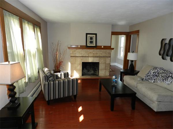 85 Appleton Street Springfield, MA 01108 - Photo 7 of 22 a living room with furniture and a fireplace