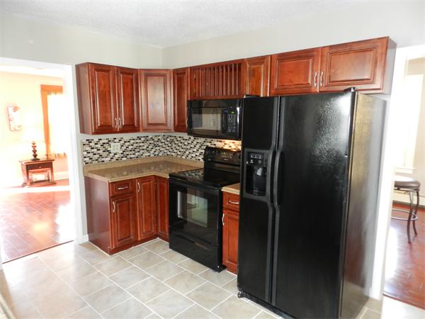 85 Appleton Street Springfield, MA 01108 - Photo 9 of 22 a kitchen with a refrigerator and a oven