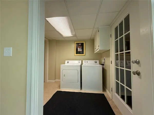 a view of a kitchen with fridge and a sink