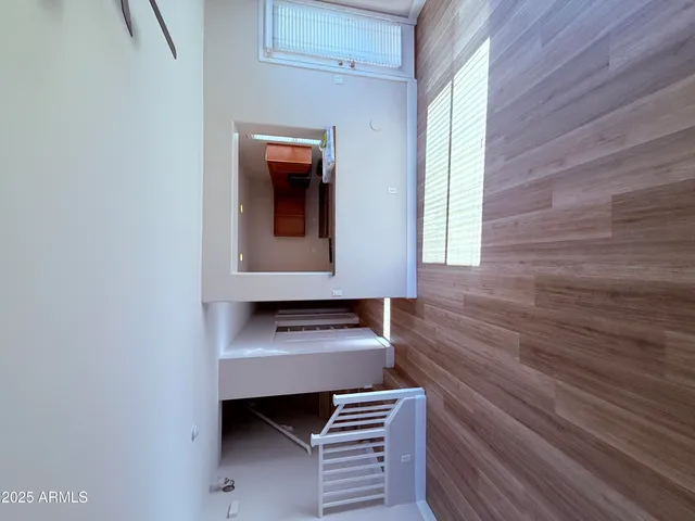 a view of room with window and wooden floor