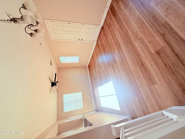 a living room with a couch and wooden floor