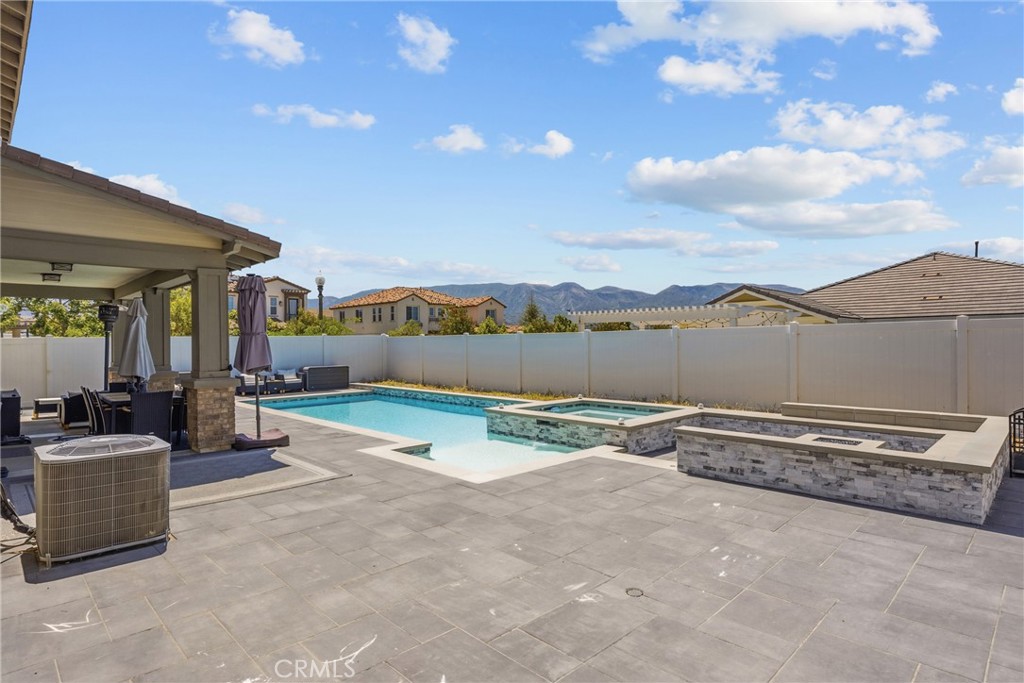 232 River Street Fillmore, CA 93015 - Photo 56 of 61 Exceptional outdoor entertaining space featuring a sparling poo, cozy firepit, ample seating areas, and a wood-burning-fireplace, perfect for or hosting gatherings year-round