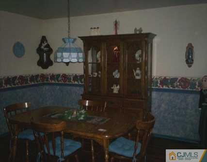 36 Raleigh Road Kendall Park, NJ 08824 - Photo 4 of 6 a view of dinning table and chairs in a room
