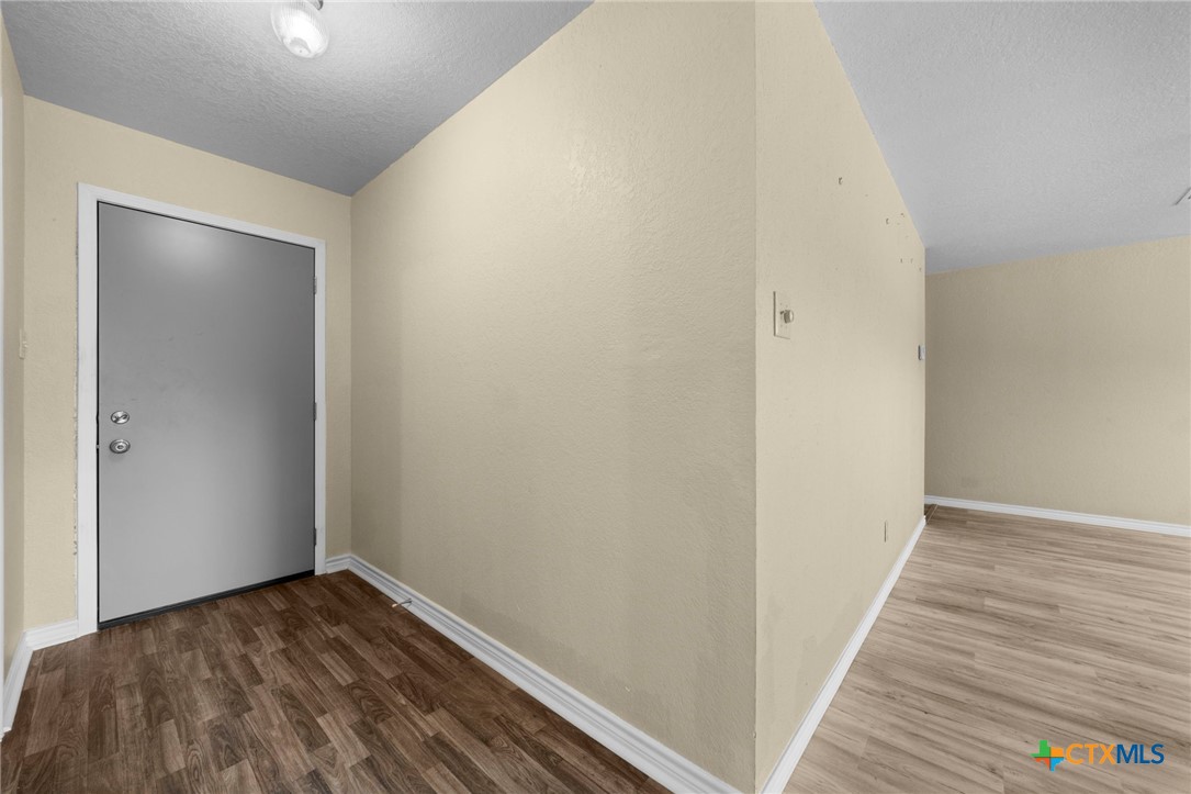 1012 Cherokee Trail Kempner, TX 76539 - Photo 13 of 27 a view of a hallway with wooden floor