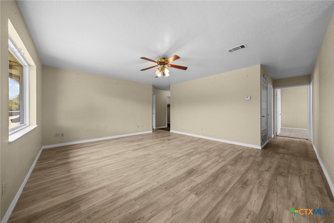 1012 Cherokee Trail Kempner, TX 76539 - Photo 16 of 27 wooden floor in an empty room with a window