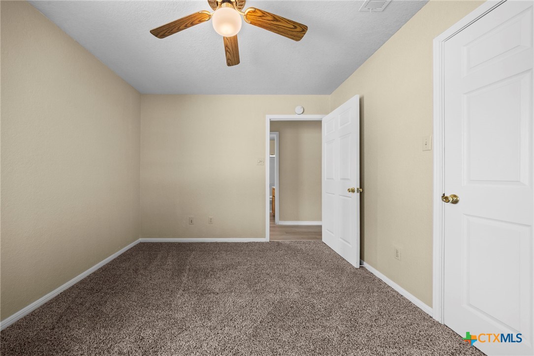 1012 Cherokee Trail Kempner, TX 76539 - Photo 23 of 27 an empty room with a empty space and a ceiling fan
