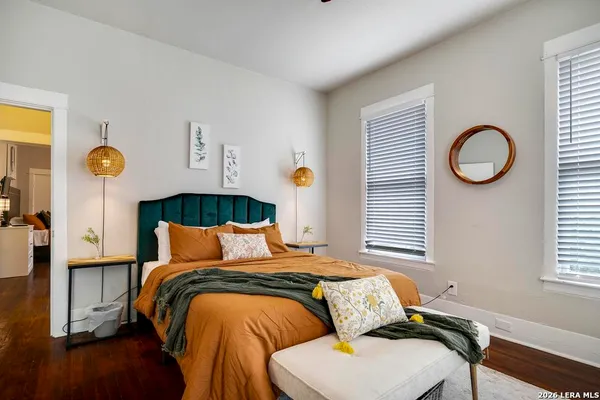 a bedroom with a bed and a window