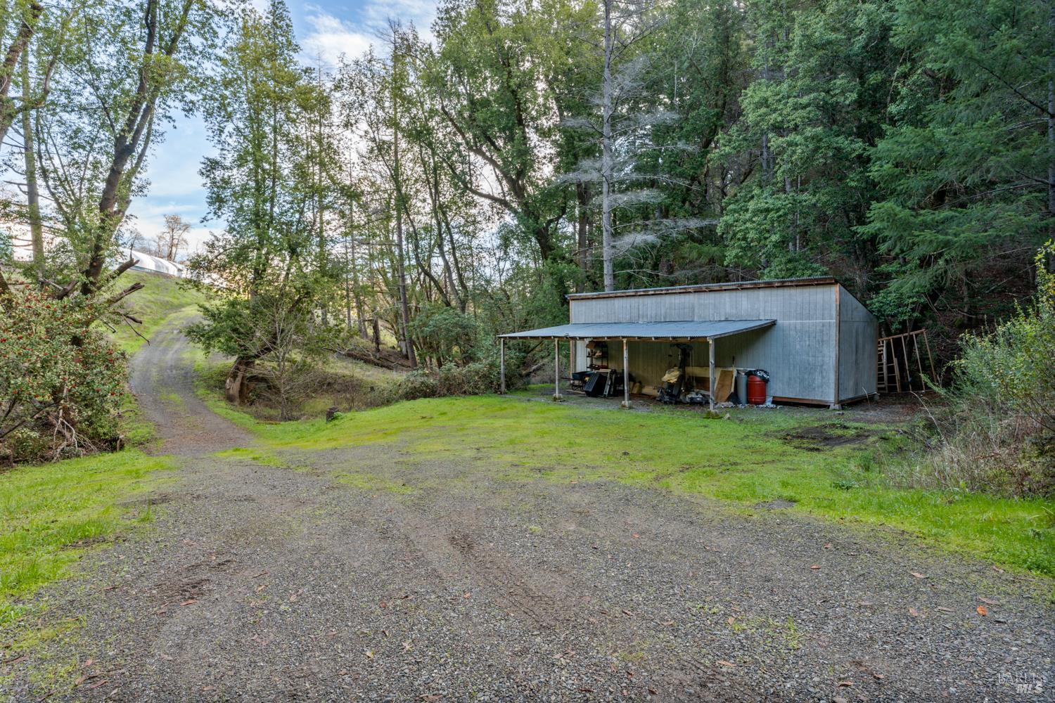 5400 Orr Springs Road Ukiah, CA 95482 - Photo 7 of 29 a view of a big house with a big yard and large trees