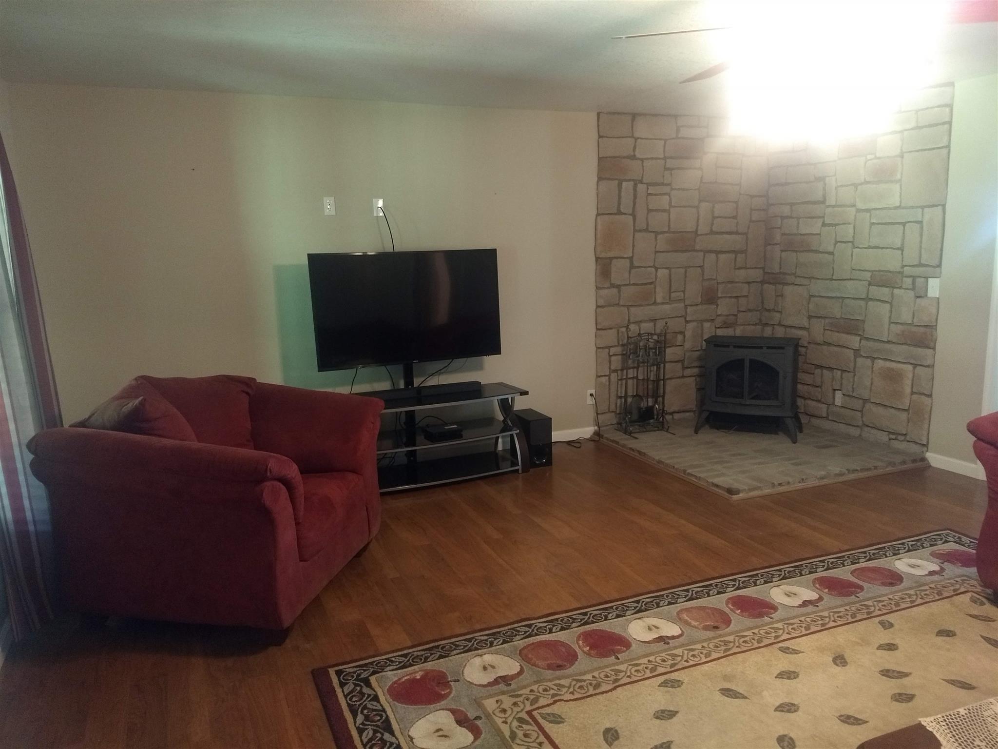 1154 Loftin Road Columbia, TN 38401 - Photo 5 of 8 a living room with furniture and a fireplace