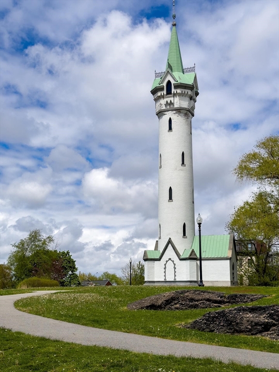 63 Beech Glen Street Boston, MA 02119 - Photo 4 of 9 a front view of a house with garden