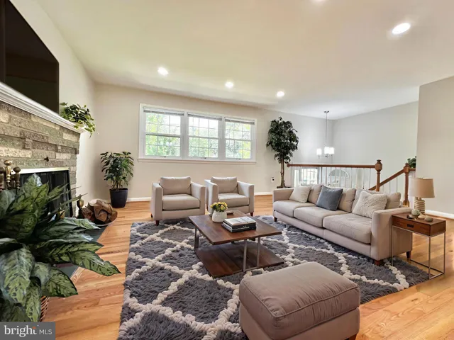 a living room with furniture fireplace and a flat screen tv