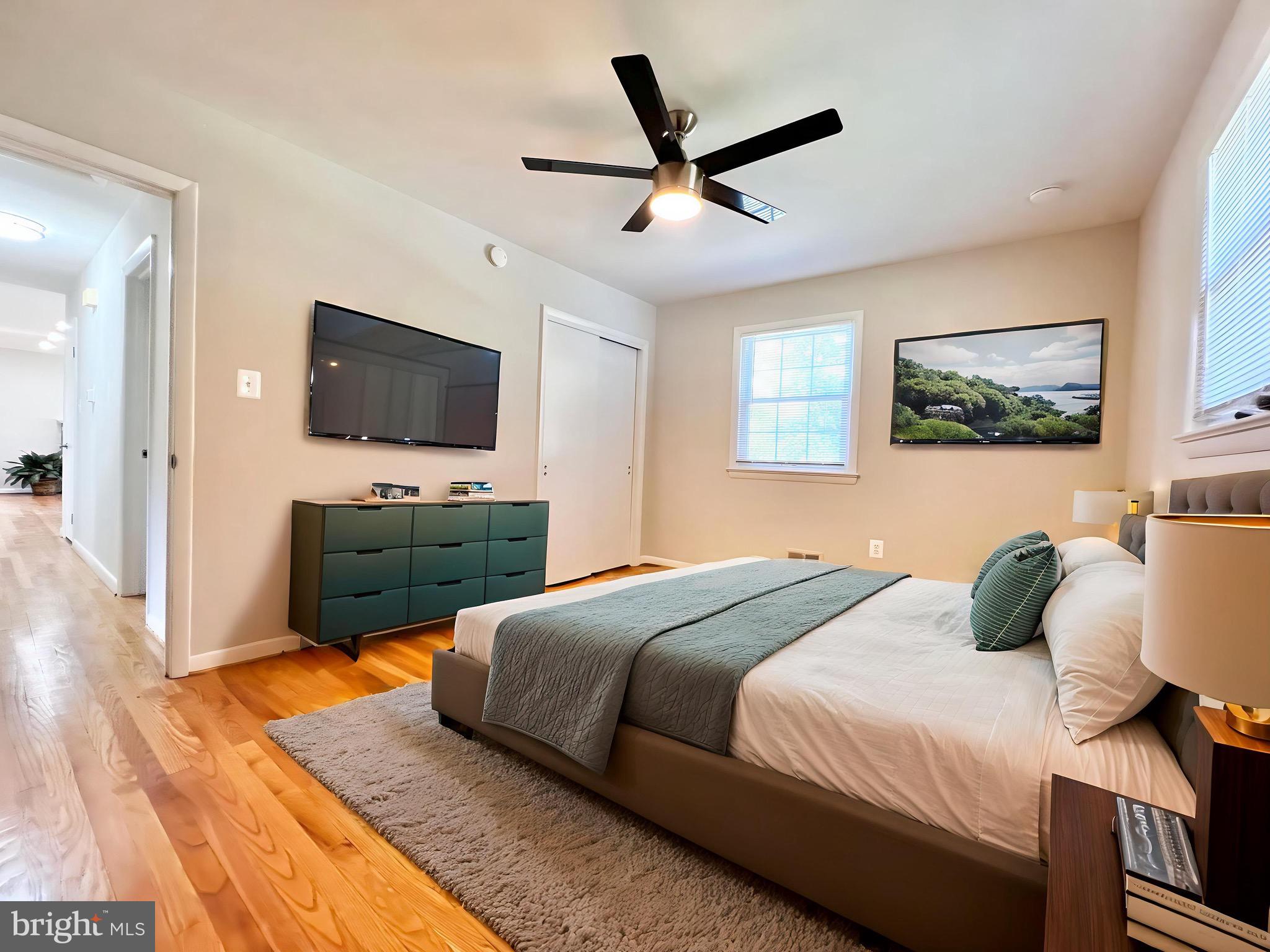 11218 Keystone Avenue Clinton, MD 20735 - Photo 25 of 53 a bedroom with a bed window and a flat screen tv