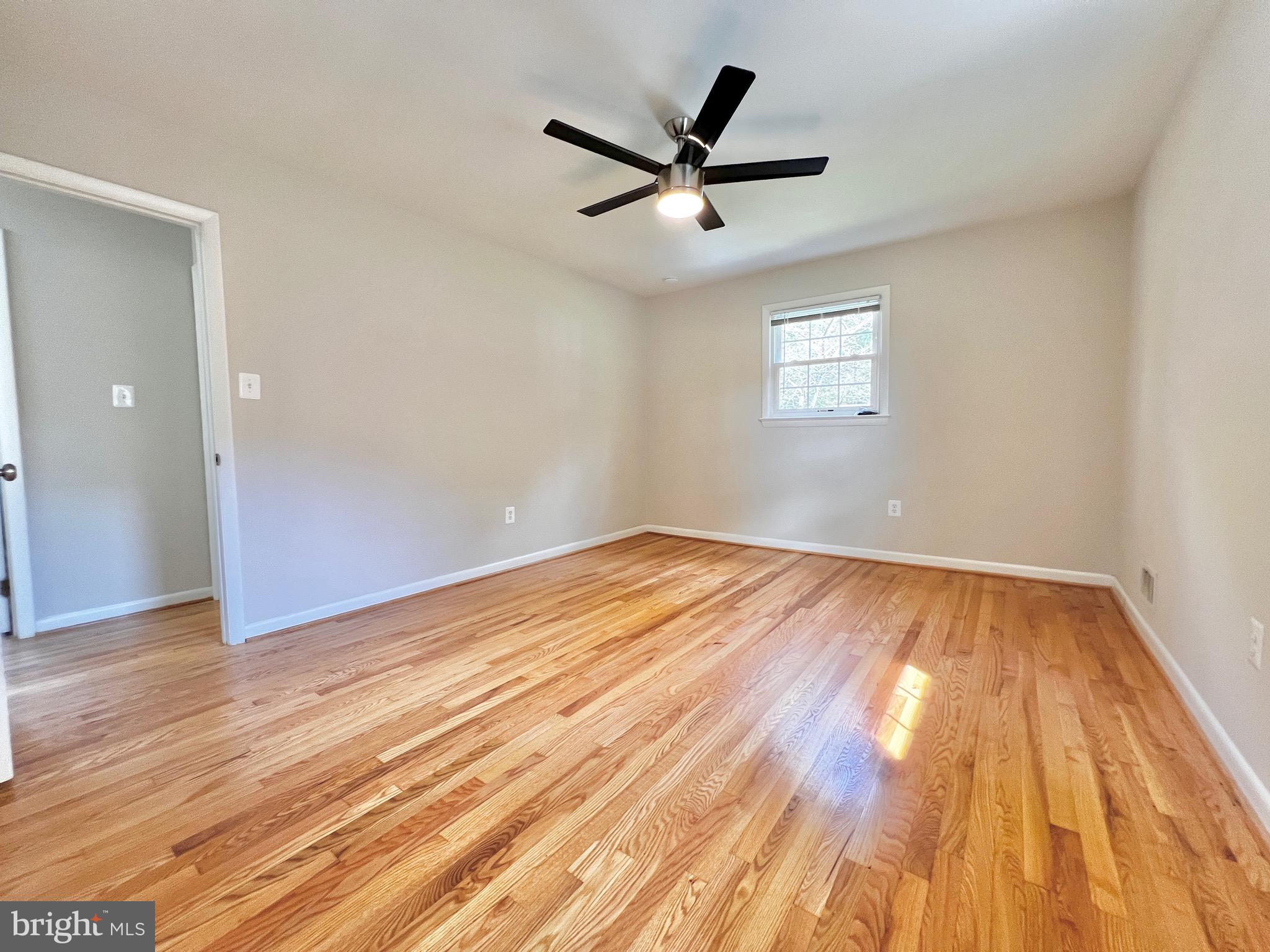 11218 Keystone Avenue Clinton, MD 20735 - Photo 31 of 53 a view of empty room with wooden floor