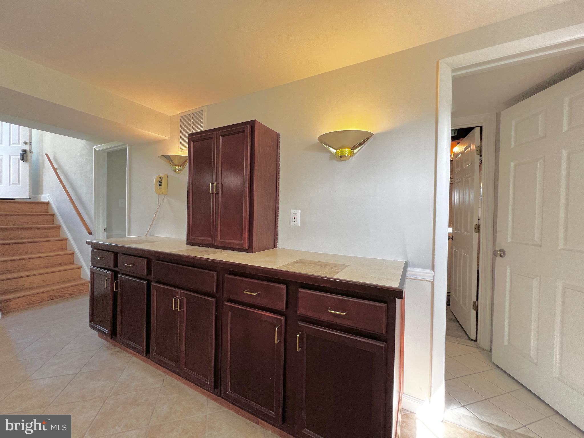 11218 Keystone Avenue Clinton, MD 20735 - Photo 40 of 53 a bathroom with a sink and a mirror