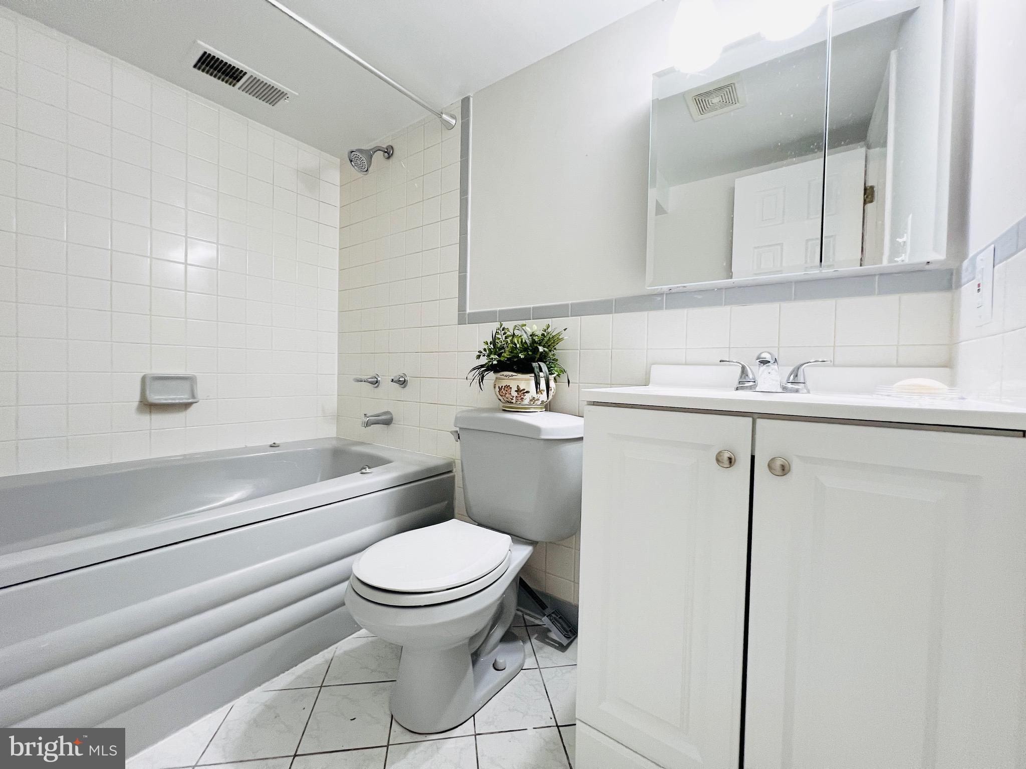 11218 Keystone Avenue Clinton, MD 20735 - Photo 44 of 53 a bathroom with a sink a toilet and shower