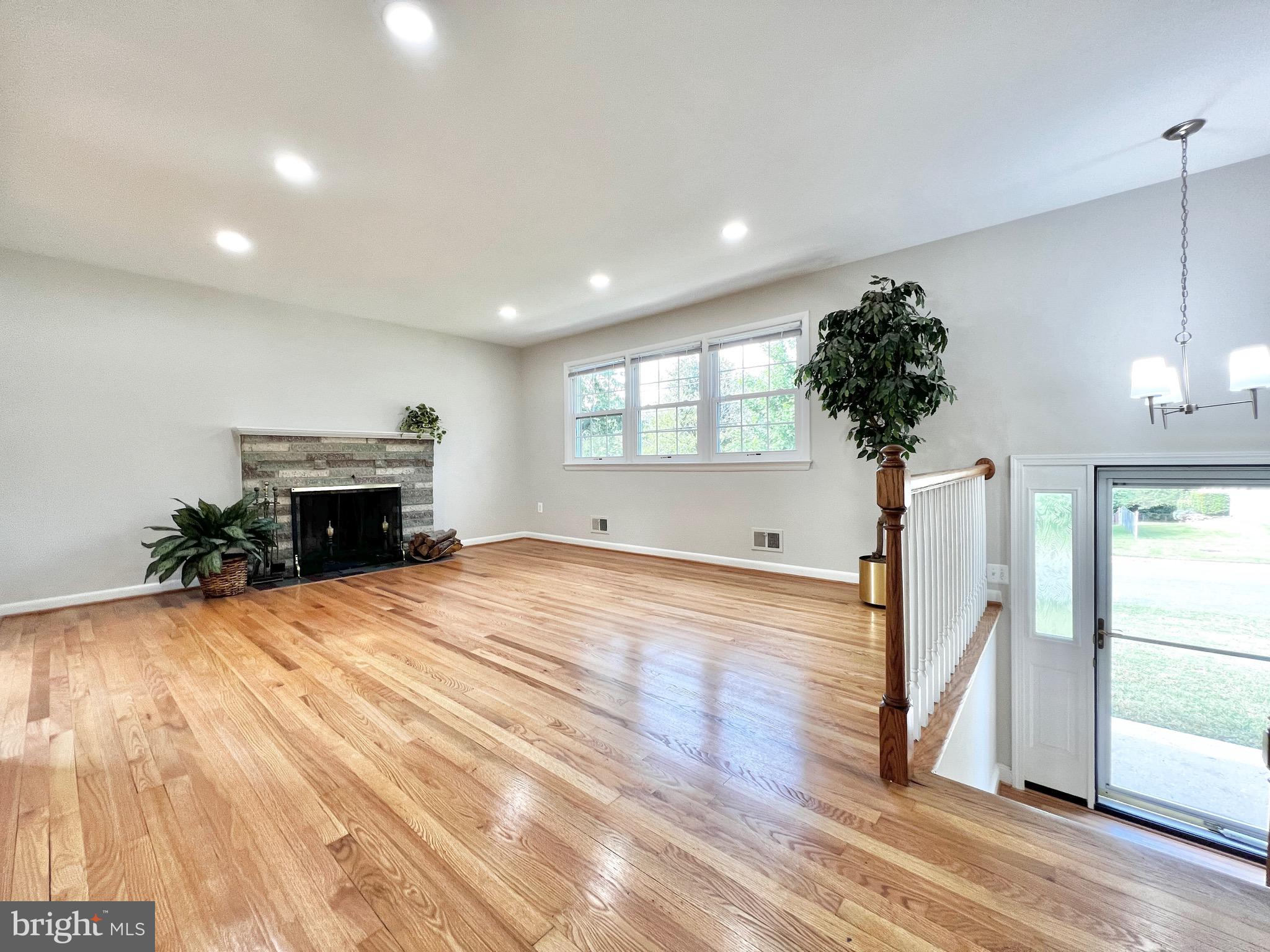 11218 Keystone Avenue Clinton, MD 20735 - Photo 5 of 53 a view of empty room with wooden floor and fan