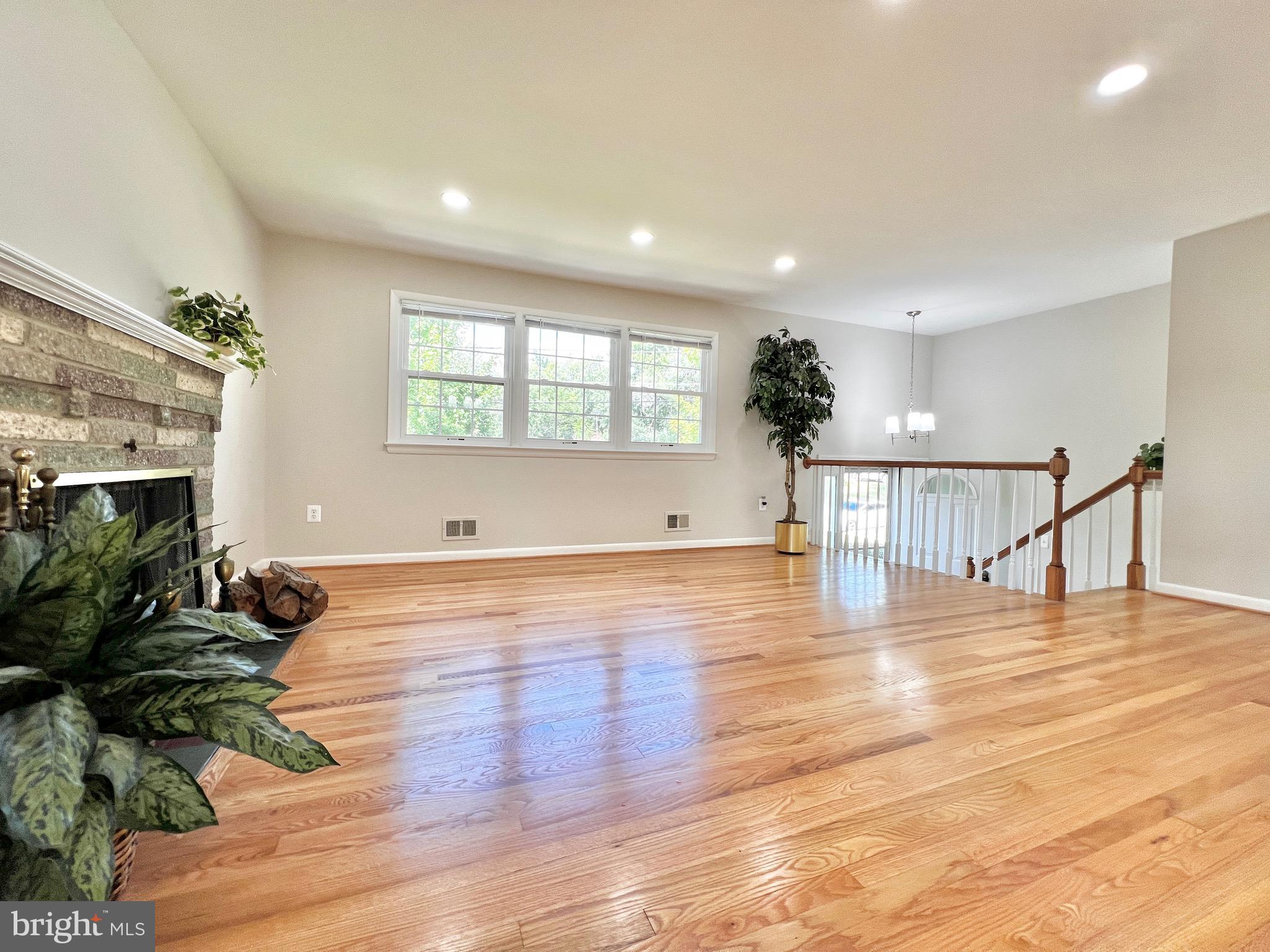 11218 Keystone Avenue Clinton, MD 20735 - Photo 7 of 53 a view of empty room with wooden floor and fan