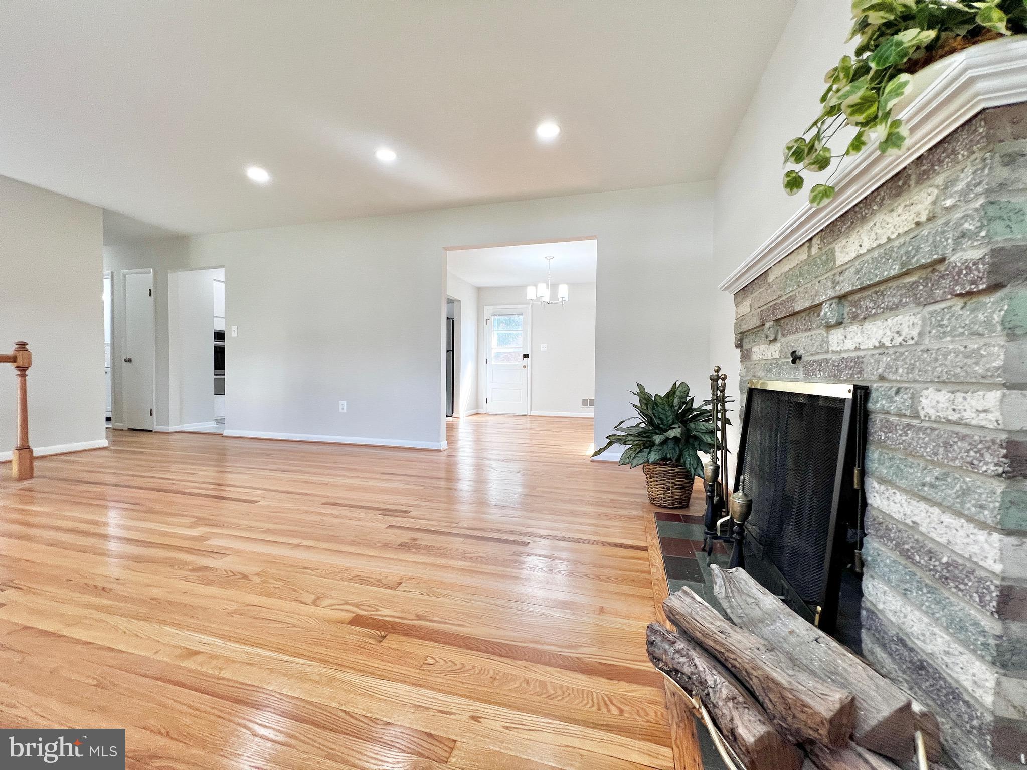11218 Keystone Avenue Clinton, MD 20735 - Photo 8 of 53 a view of a living room and entryway with wooden floor