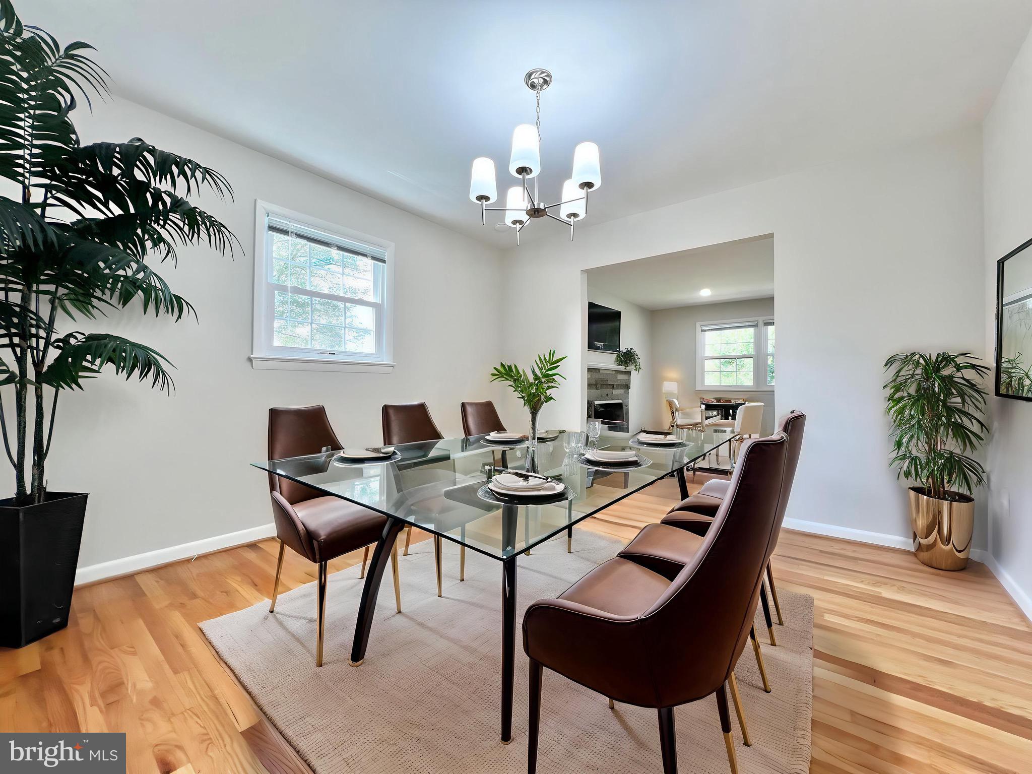 11218 Keystone Avenue Clinton, MD 20735 - Photo 10 of 53 a view of a dining room with furniture and wooden floor